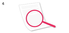 Magnifying glass inspecting paper